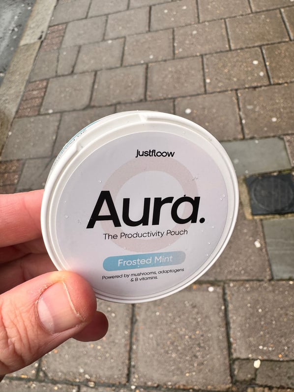 Customer holding Aura pouch